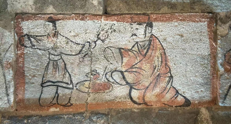 Un mural pintado sobre un ladrillo de una tumba. [Foto / chinadaily.com.cn]